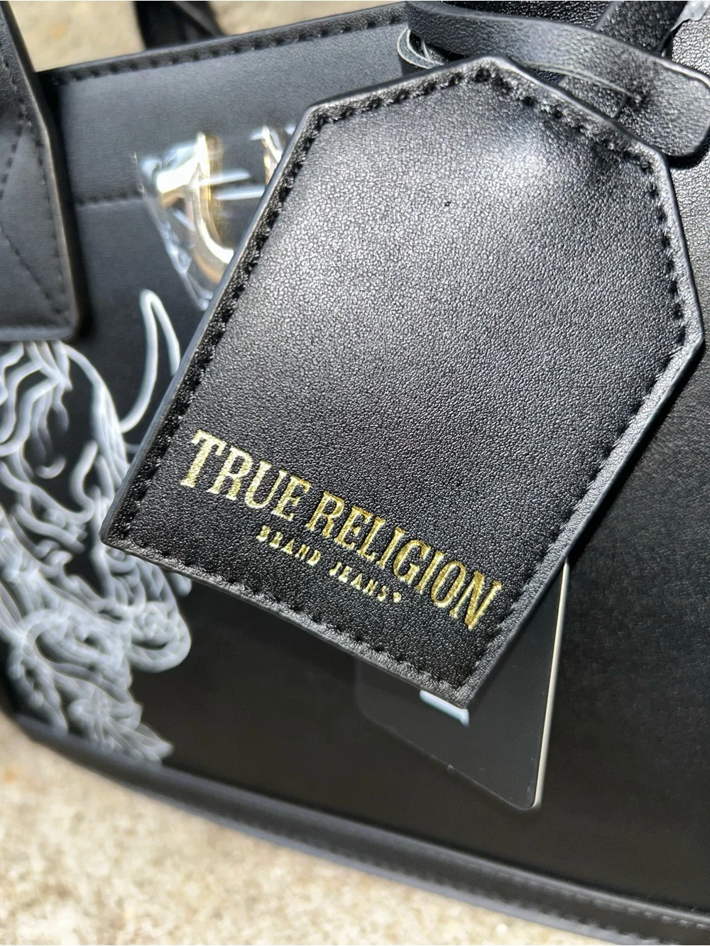 True Religion Black Satchel with White Graphic Demon Motif